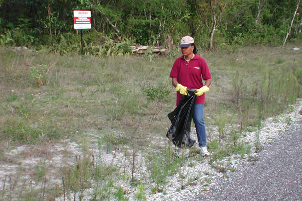 Volunteers Clean-Up Roadside Entrance to Negril - Negril Travel Guide